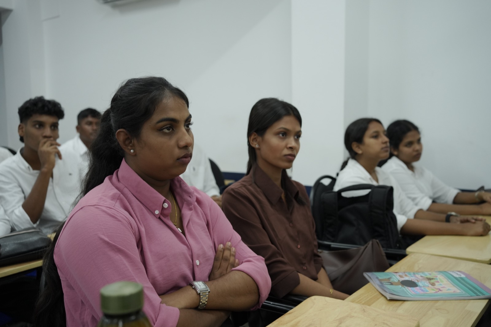 Girls and boys seated together in a NavPath classroom