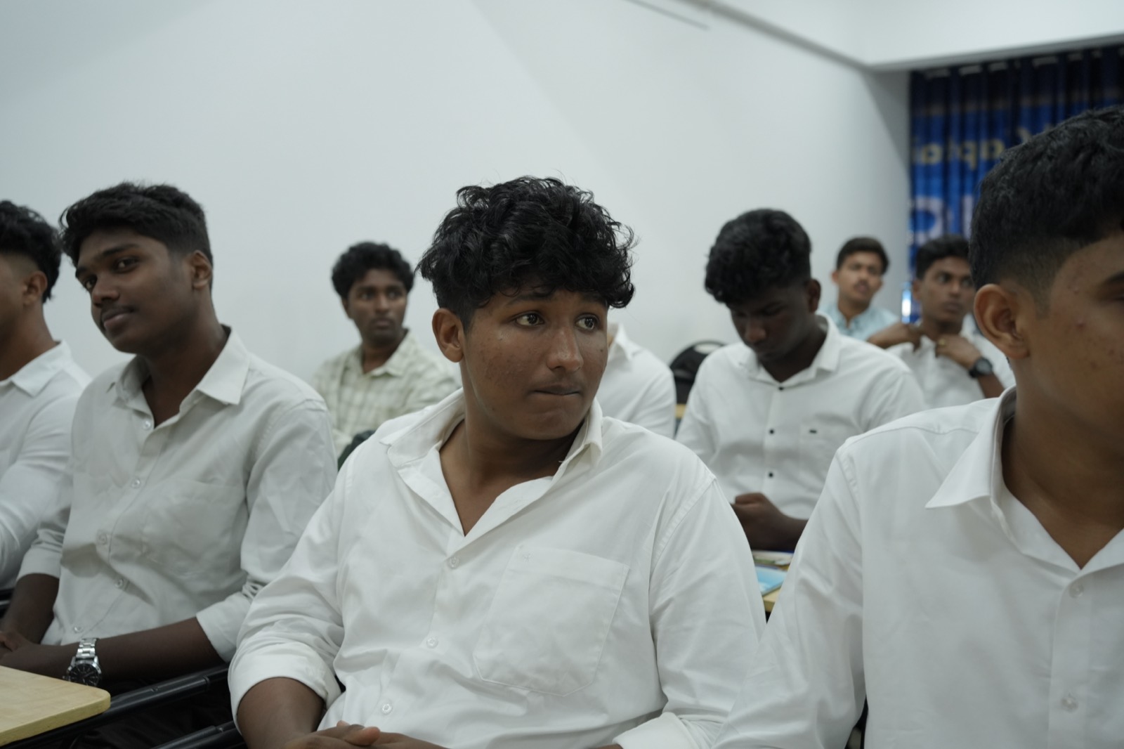 Three NavPath students smiling during a class