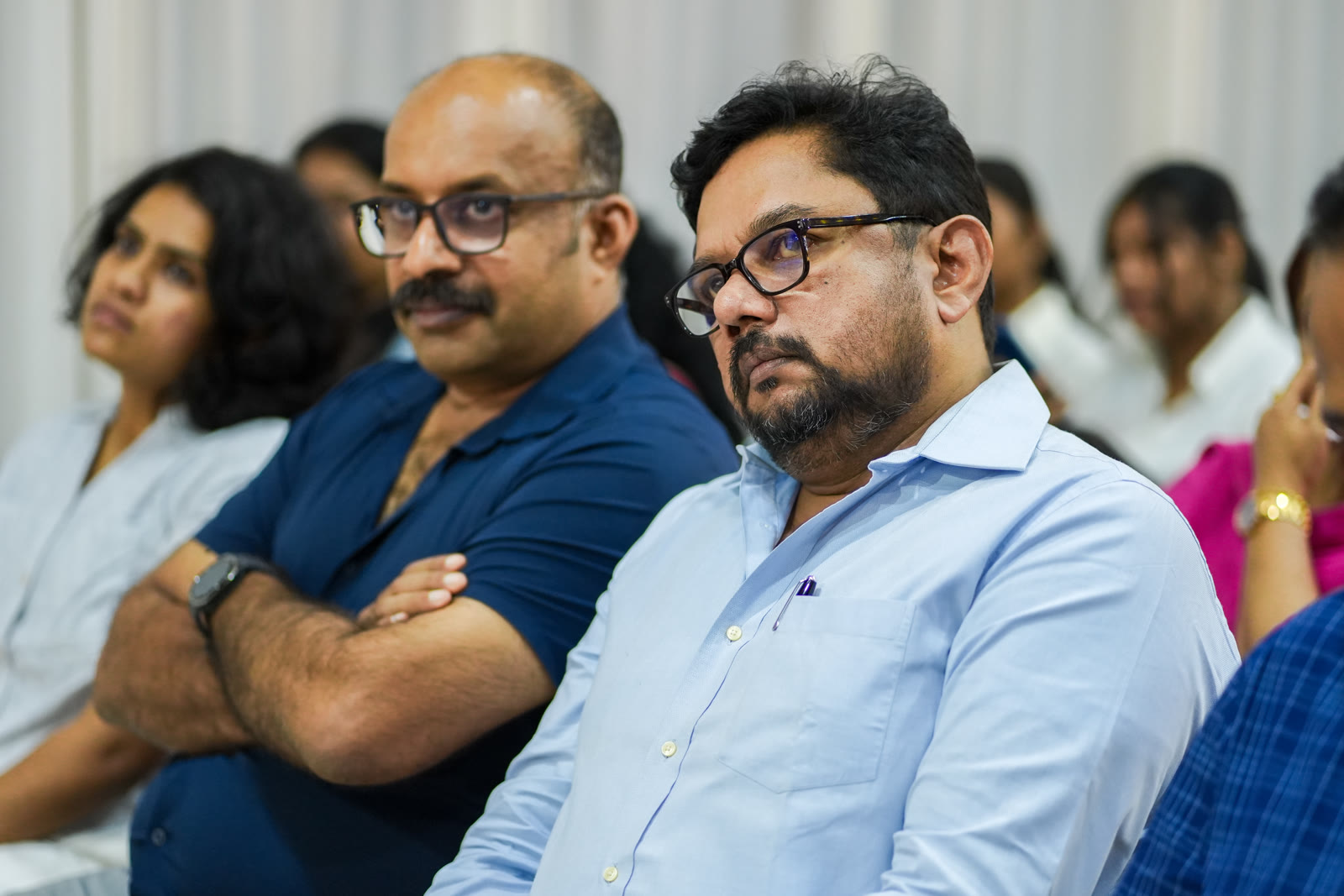 Directors listening at a NavPath Academy campus event
