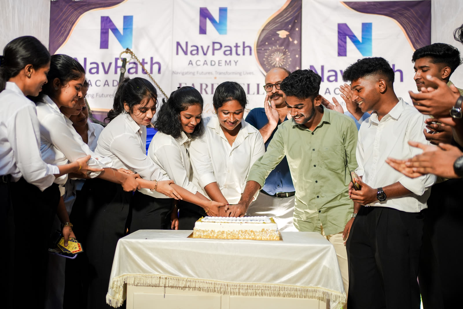Cake cutting at a NavPath Academy farewell