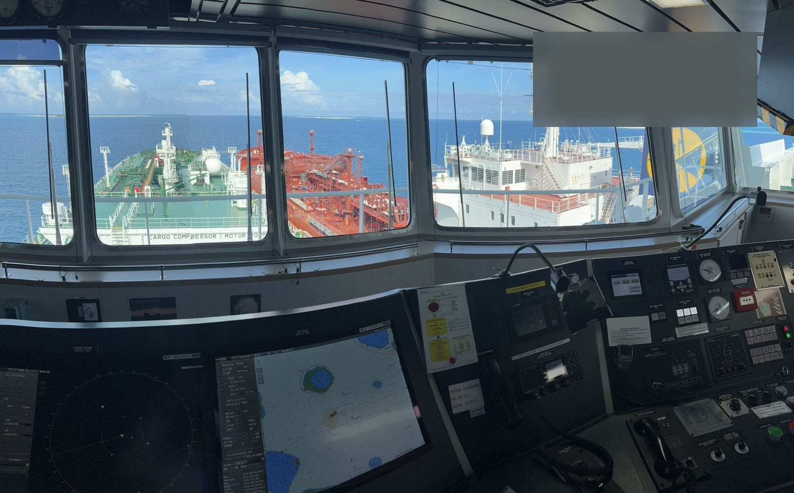 View from a ship’s bridge of another vessel alongside during a ship-to-ship transfer