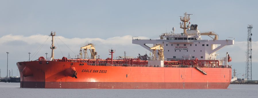 An oil tanker alongside a berth in calm water